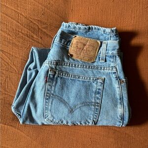 Levi’s 550 relaxed fit raw denim jeans.